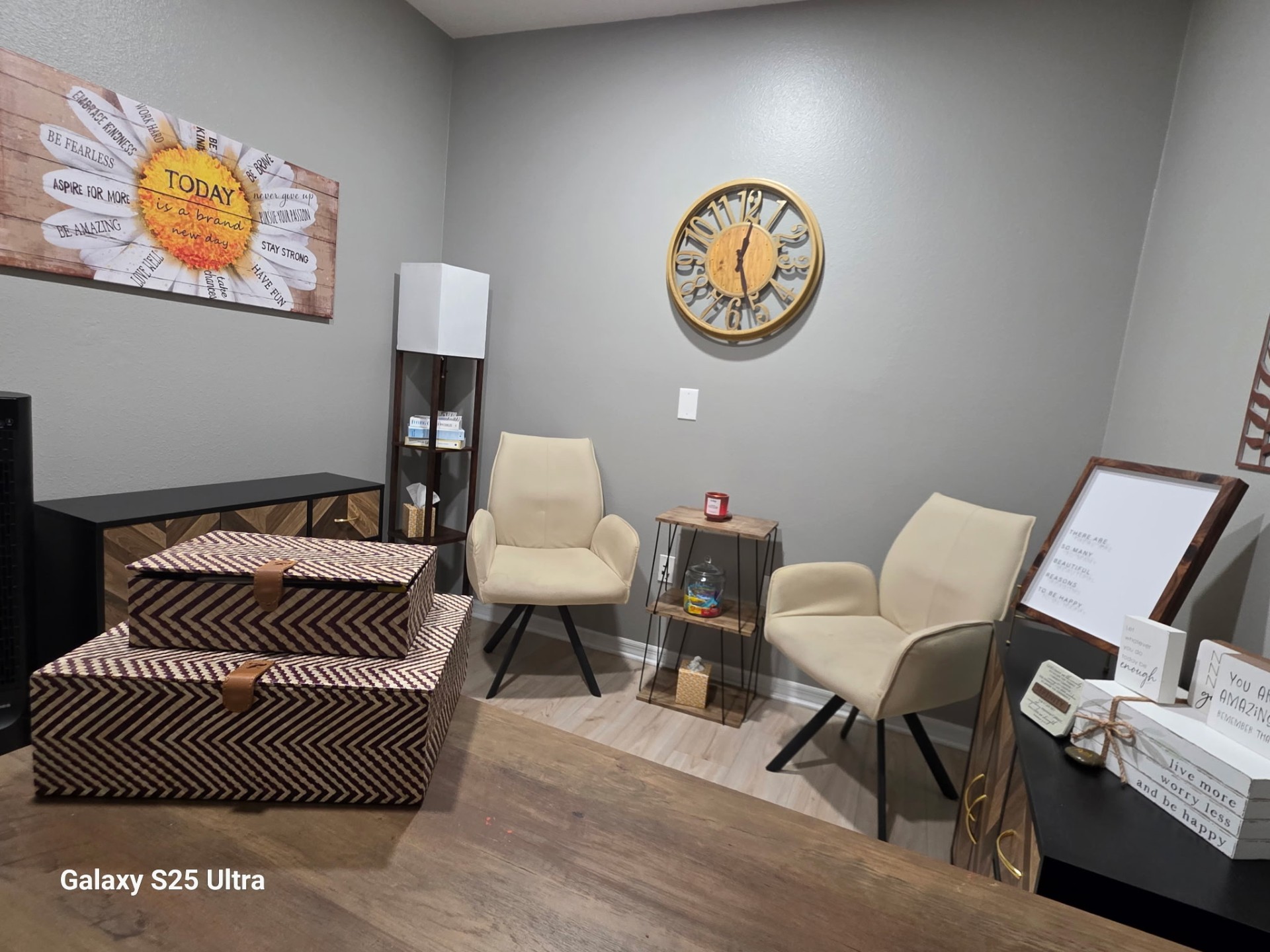 Wide view of the welcoming counseling office with affirmations and natural light